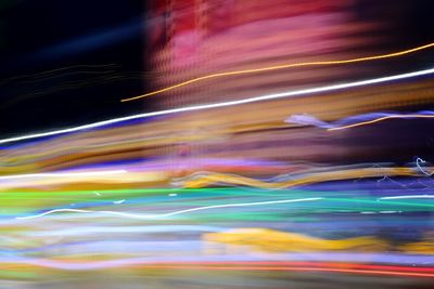 Close-up of light trails over blurred background