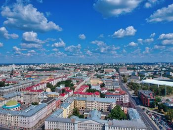 High angle view of cityscape against blue sky