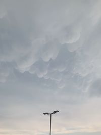 Low angle view of street light against sky