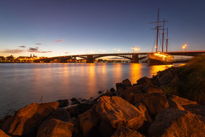 View of bridge over river against sky during sunset