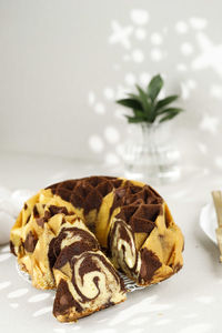 Slice chocolate marble vanilla bundt cake or zebra cake, copy space for text