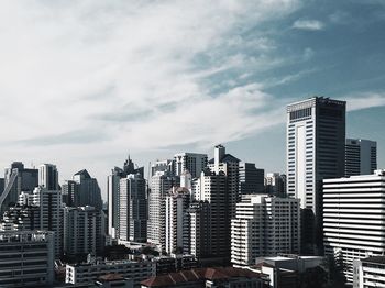 Modern buildings in city against sky
