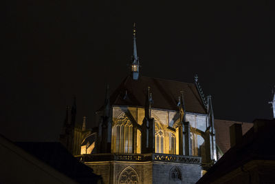 Low angle view of illuminated cathedral against sky at night