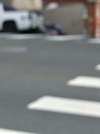 Defocused image of car on road