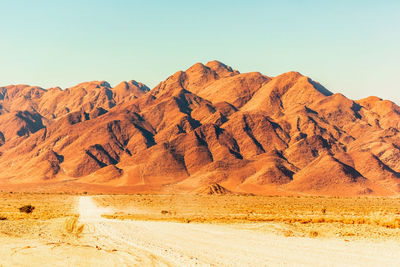 Scenic view of desert against clear sky