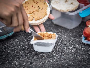 Close-up of hand holding ice cream