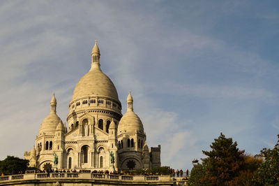 Low angle view of cathedral against cloudy sky