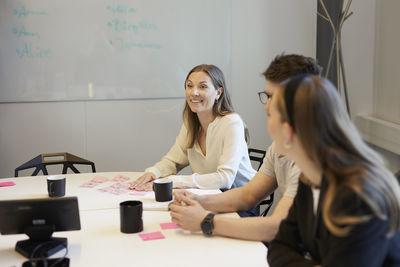 Smiling people at business meeting