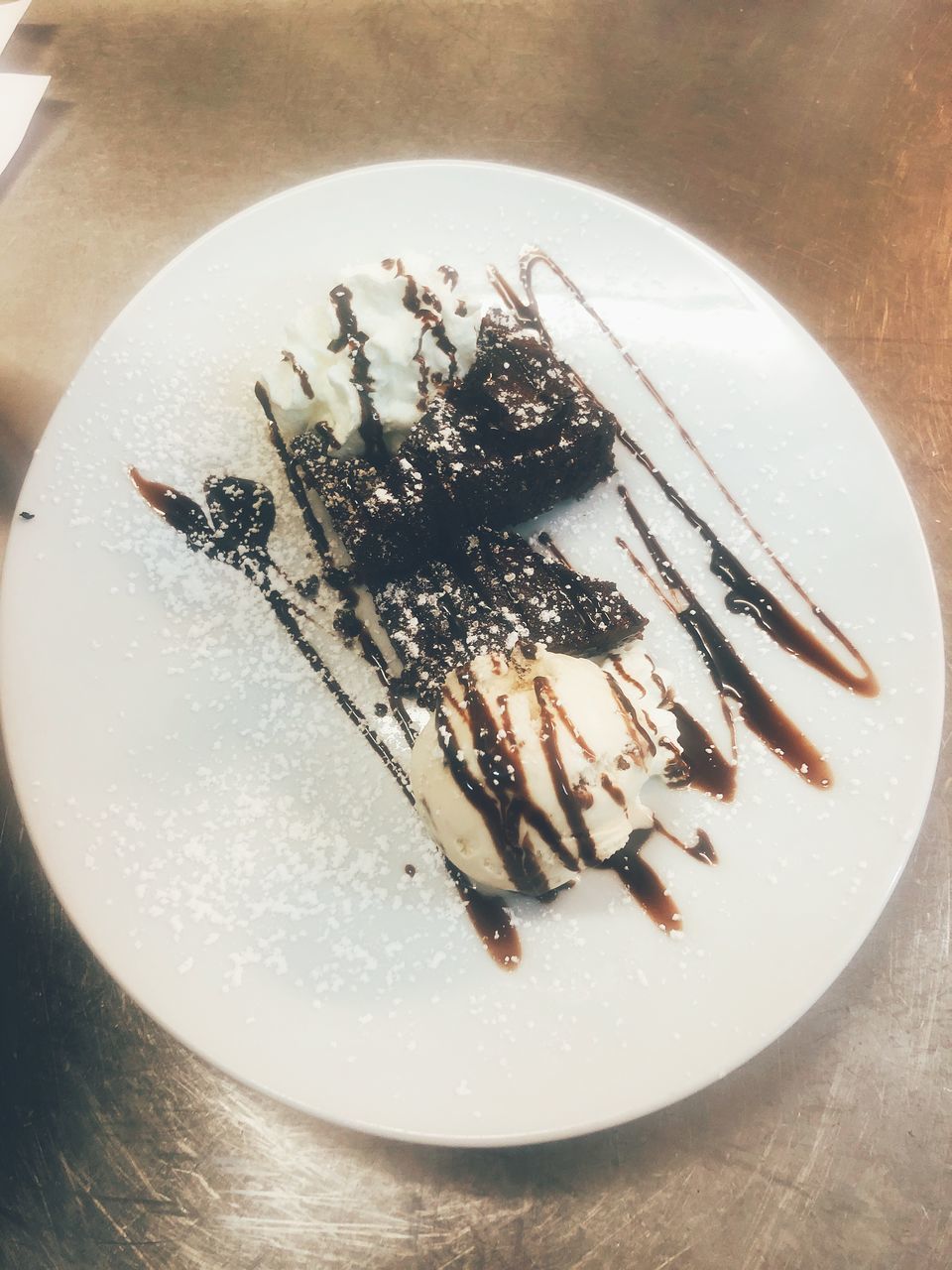 HIGH ANGLE VIEW OF CAKE ON TABLE