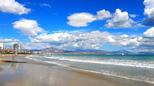 Scenic view of beach against sky in city