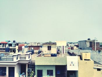 Residential buildings against clear sky