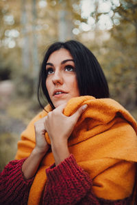 Portrait of young woman looking at camera