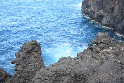 High angle view of rock formation at sea shore