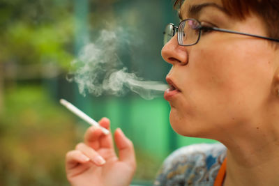 Portrait of man smoking cigarette