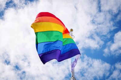 Low angle view of flag against sky