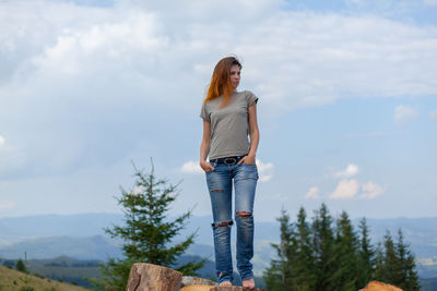 Girl posing and gesturing in the summer high in the carpathian mountains