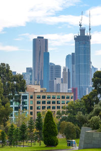 Buildings in city against sky