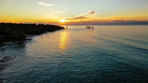 Scenic view of sea against sky during sunset