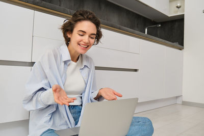 Portrait of young businesswoman standing in office