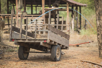 Abandoned push cart on field