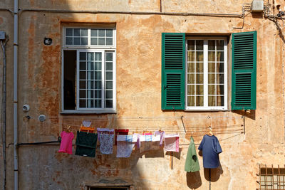 Clothes drying against building