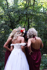 Women standing in forest