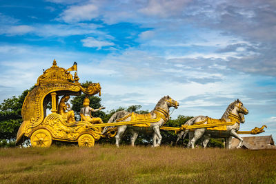 Holly arjuna chariot of mahabharata in golden color with amazing sky background