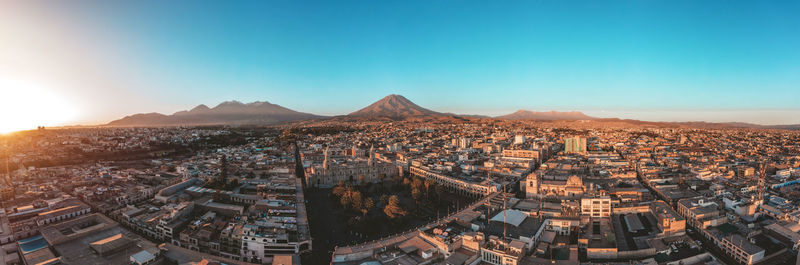 Aerial view of townscape against sky during sunset