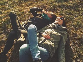 Friends sitting on ground