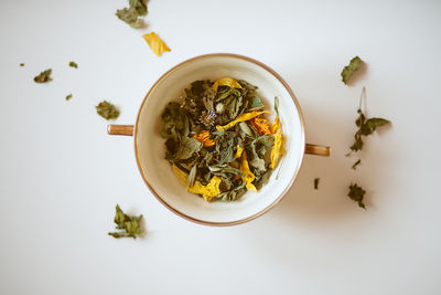 High angle view of tea on table against white background