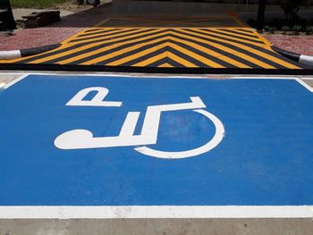 High angle view of arrow sign on road