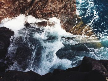 Waves splashing on rocks