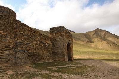 Old ruin building against cloudy sky