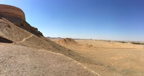 Scenic view of desert against clear sky