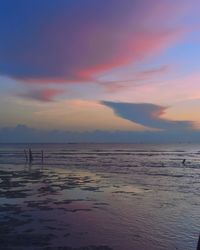 Scenic view of sea against sky at sunset