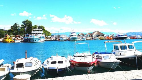 Boats moored at harbor