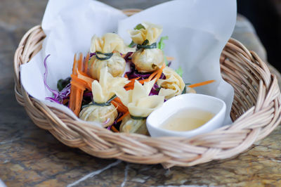 High angle view of vegetables in basket on table