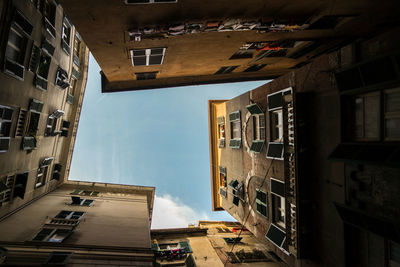 Low angle view of buildings in city against sky