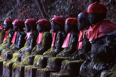 Old statues in row at park