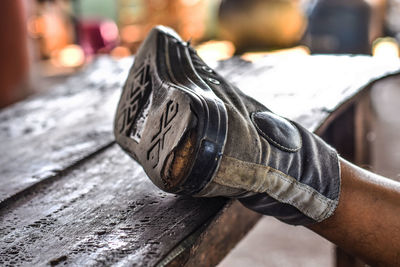 Close-up of man shoes on wood