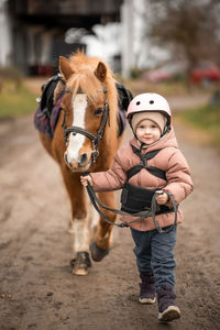 Portrait of woman riding horse