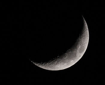 Low angle view of moon against sky at night