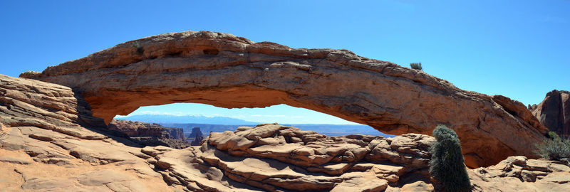 Rock formations against clear blue sky