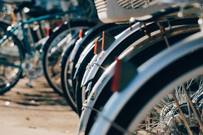 Close-up of bicycle parked in row