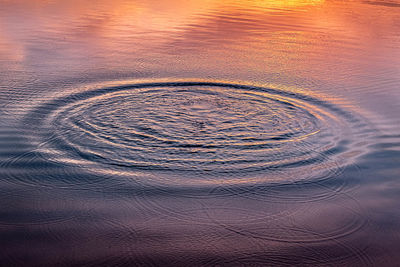 Full frame shot of rippled water at sunset