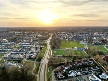 High angle view of buildings against sky during sunset