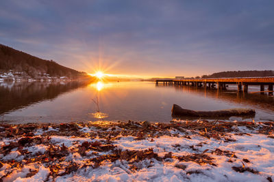 Beautiful sunset at the lake wallersee, austria, winter season