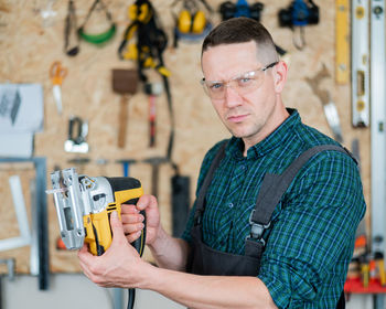 Young man working in workshop