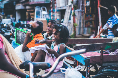 Children studying on bench