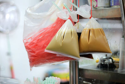 Close-up of liquid in plastic bags for sale